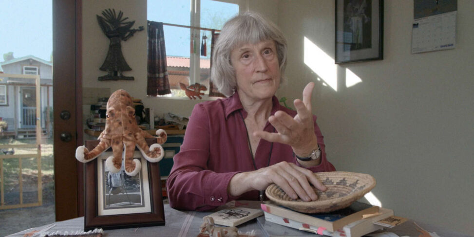 A still showing Donna Haraway in her office from the documentary 'Donna Haraway, Story Telling for Earthly Survival' by Fabrizio Terranova. Haraway is also the authoor of the text Cyborg Manifesto.