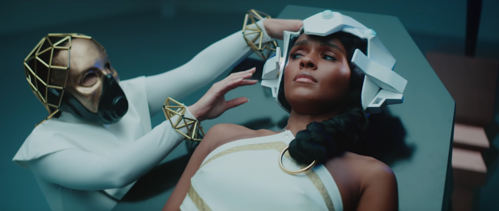 A still from Janelle Monáe’s "Dirty Computer" from 2018. The cyborg Jane, is seen as a “dirty computer” that must be “cleaned”.
