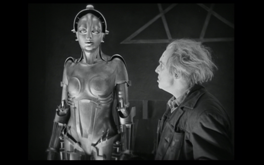 Still of the movie "Metropolis" by Fritz Lang from 1927. Where the creator eyes his cyborg creation.